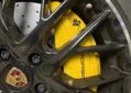 Porsche Panamera front wheel upgrade Original factory top with Akibono 10-piston calipers with 420 gauge PCCB carbon tray set original position upgrade installation