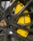 Porsche Panamera front wheel upgrade Original factory top with Akibono 10-piston calipers with 420 gauge PCCB carbon tray set original position upgrade installation