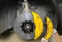 Porsche Panamera front wheel upgrade Original factory top with Akibono 10-piston calipers with 420 gauge PCCB carbon tray set original position upgrade installation